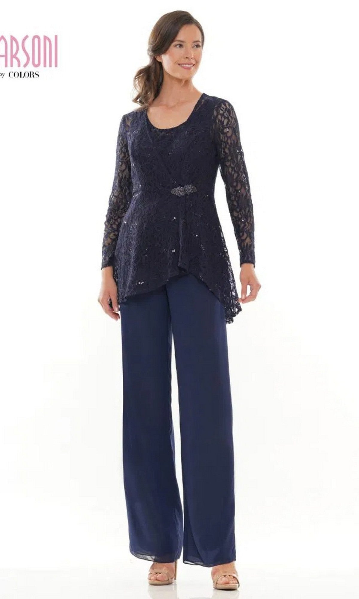 Woman modeling the Marsoni M305 long formal pantsuit in navy, featuring a lace jacket with beaded detail and matching wide-leg pants, standing against a plain white background.
